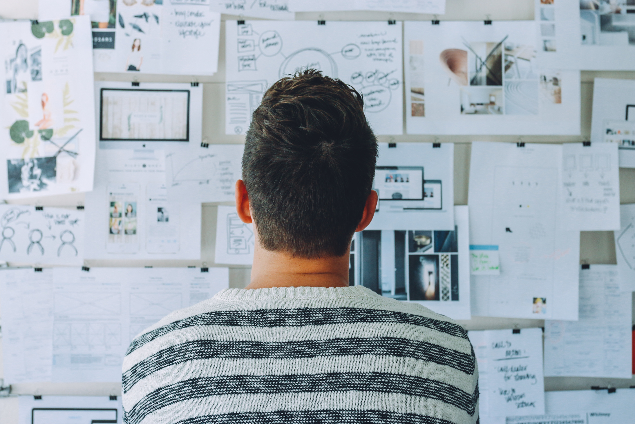 Male Entrepreneur Looking at His Vision Board